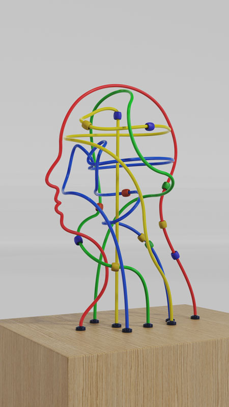 A human head-shaped bead maze made from colourful looping wires and sliding beads.